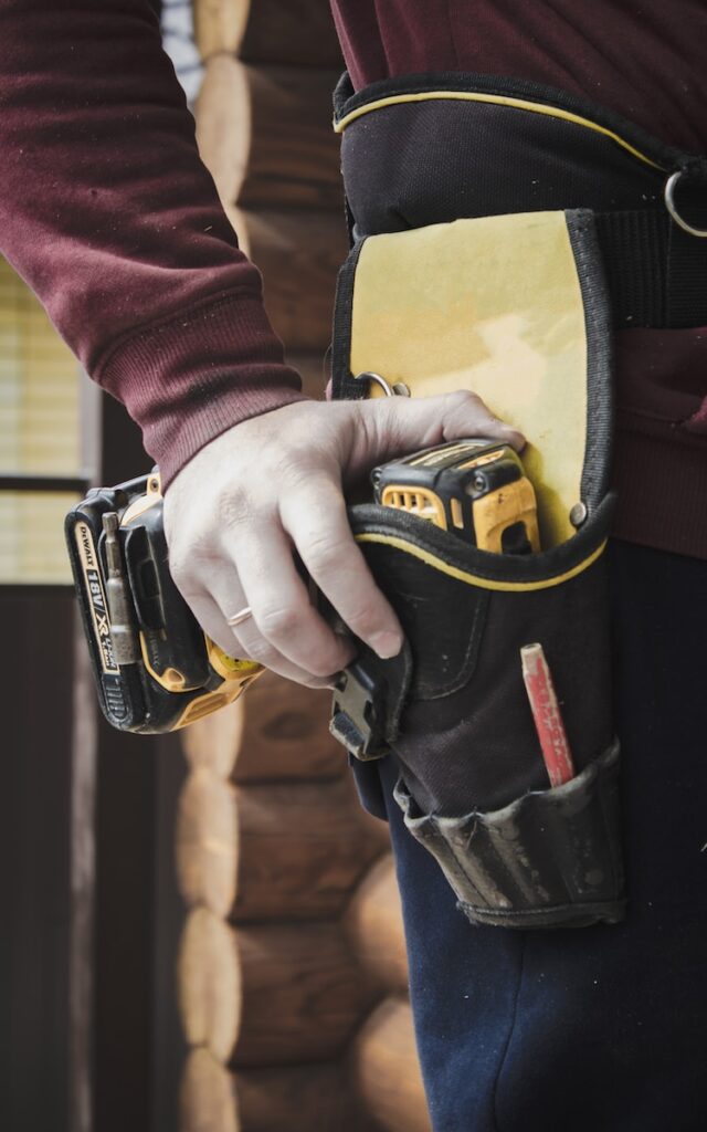 Professional countertop installer with tool belt