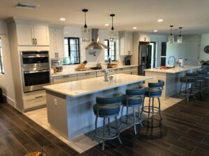 Kitchen with white island waterfall countertop